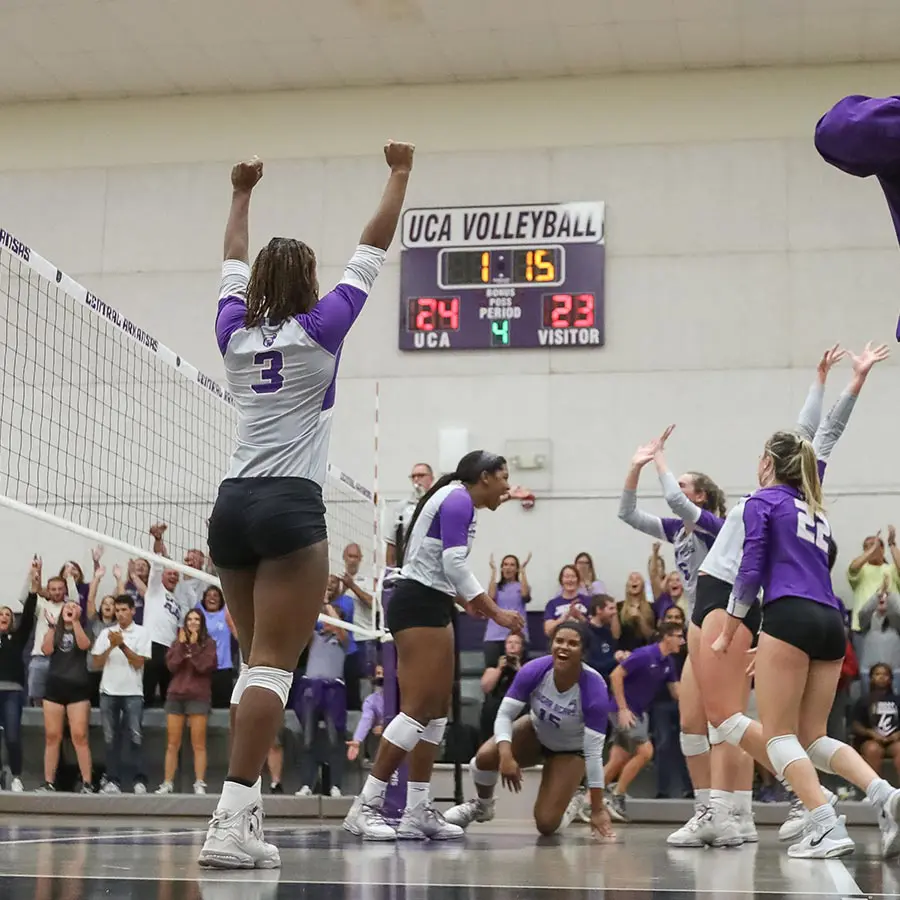 female volleyball players celebrating
